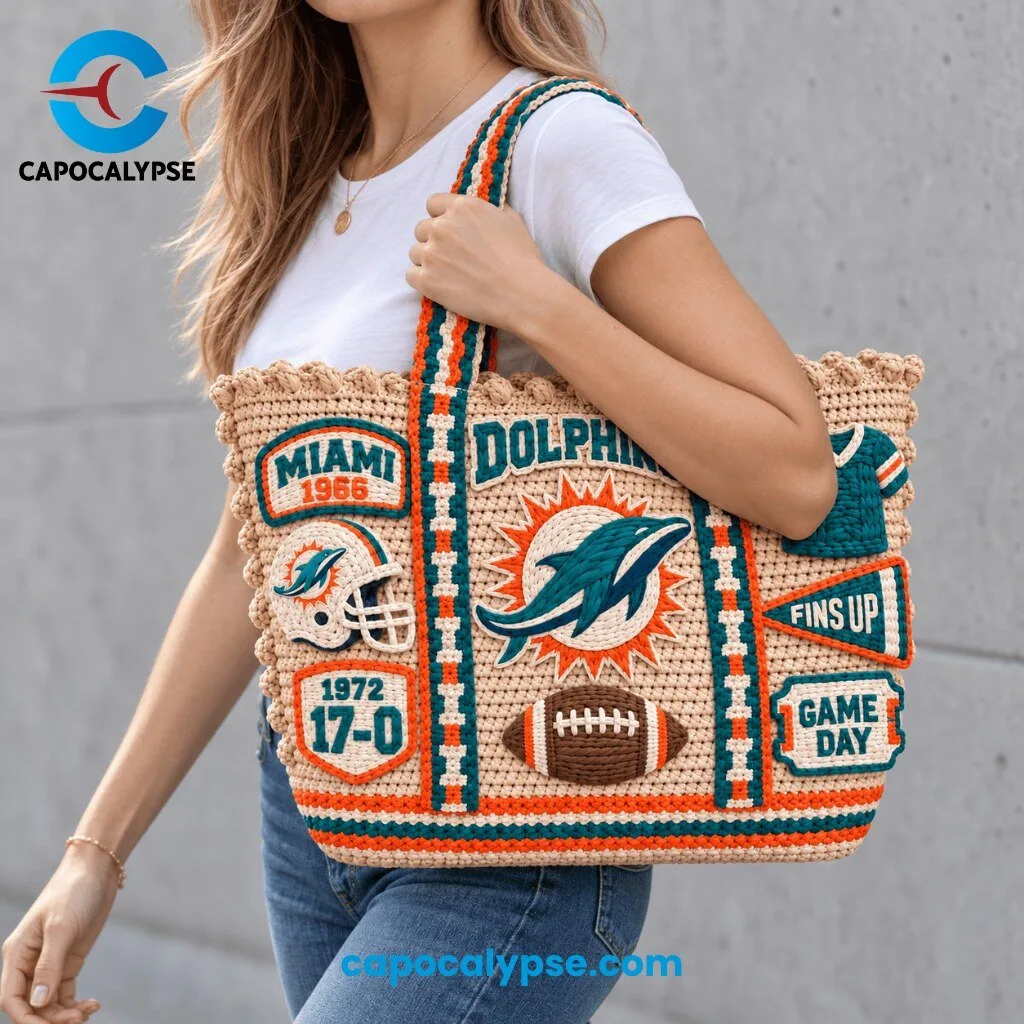 Miami Dolphins Crochet Tote Bag 4 Miami Dolphins crochet tote bag featuring cream knit body with teal embroidered jumping dolphin logo, Miami 1966 patch, helmet, 1972 17-0 undefeated season, and Fins Up Game Day text, with teal and orange stripe twisted handles