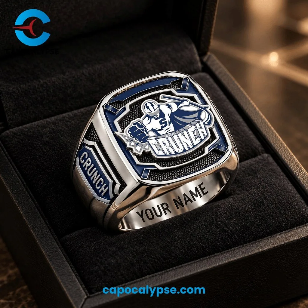 Grunch Personalized Championship Hockey Ring 1 Grunch hockey ring with navy blue white and gold enamel shield featuring eagle mascot logo, gold lettering, personalized engraving band