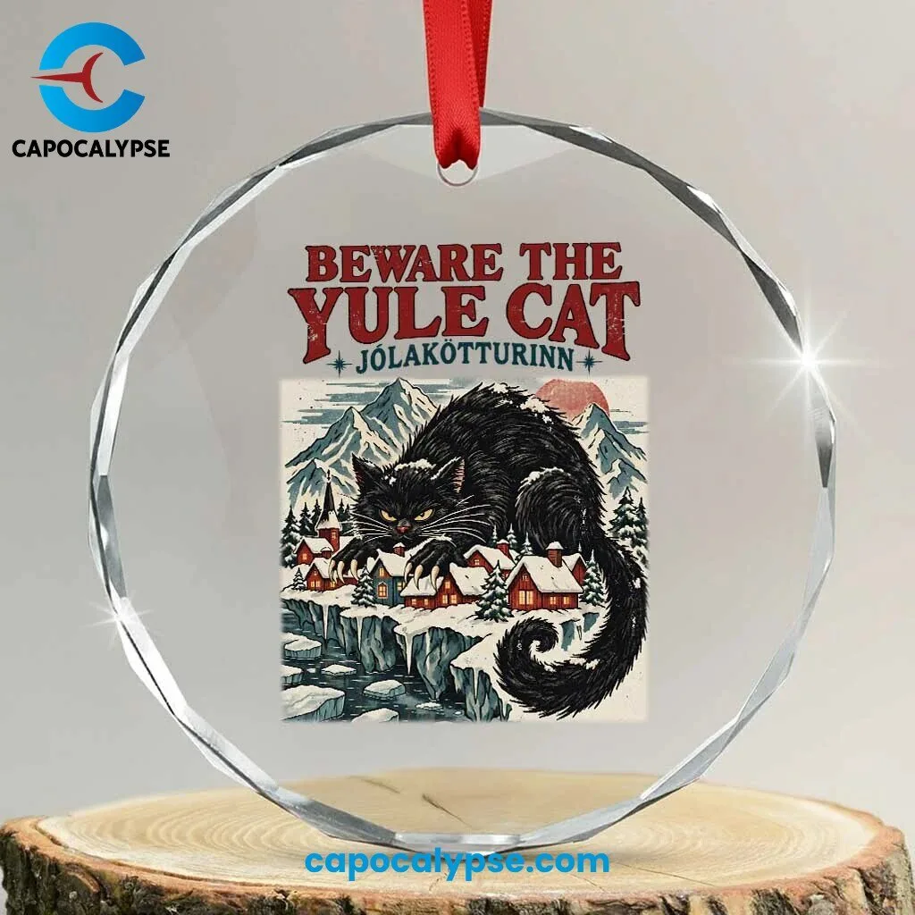 Beware The Yule Cat Jolakotturinn Acrylic Ornament 1 Beware The Yule Cat Jolakotturinn glass ornament with black cat over a snowy red-roofed village, red ribbon and faceted edge on a wood slice